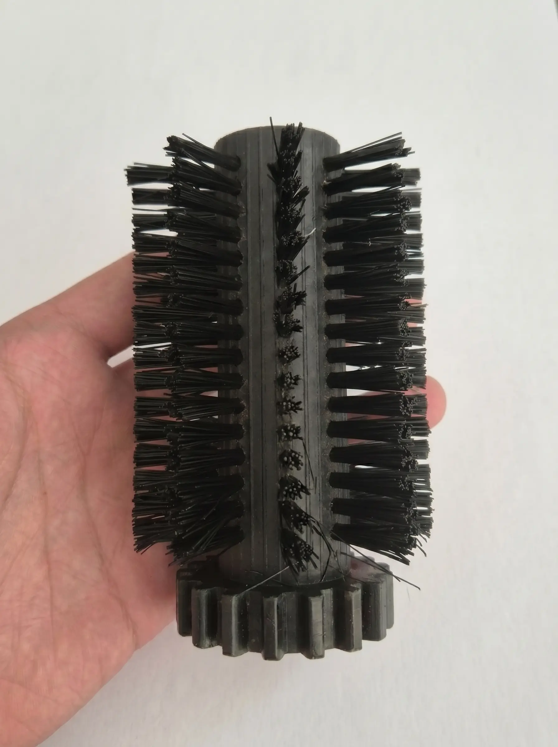 Original damaged OEM cleaning roller in hand