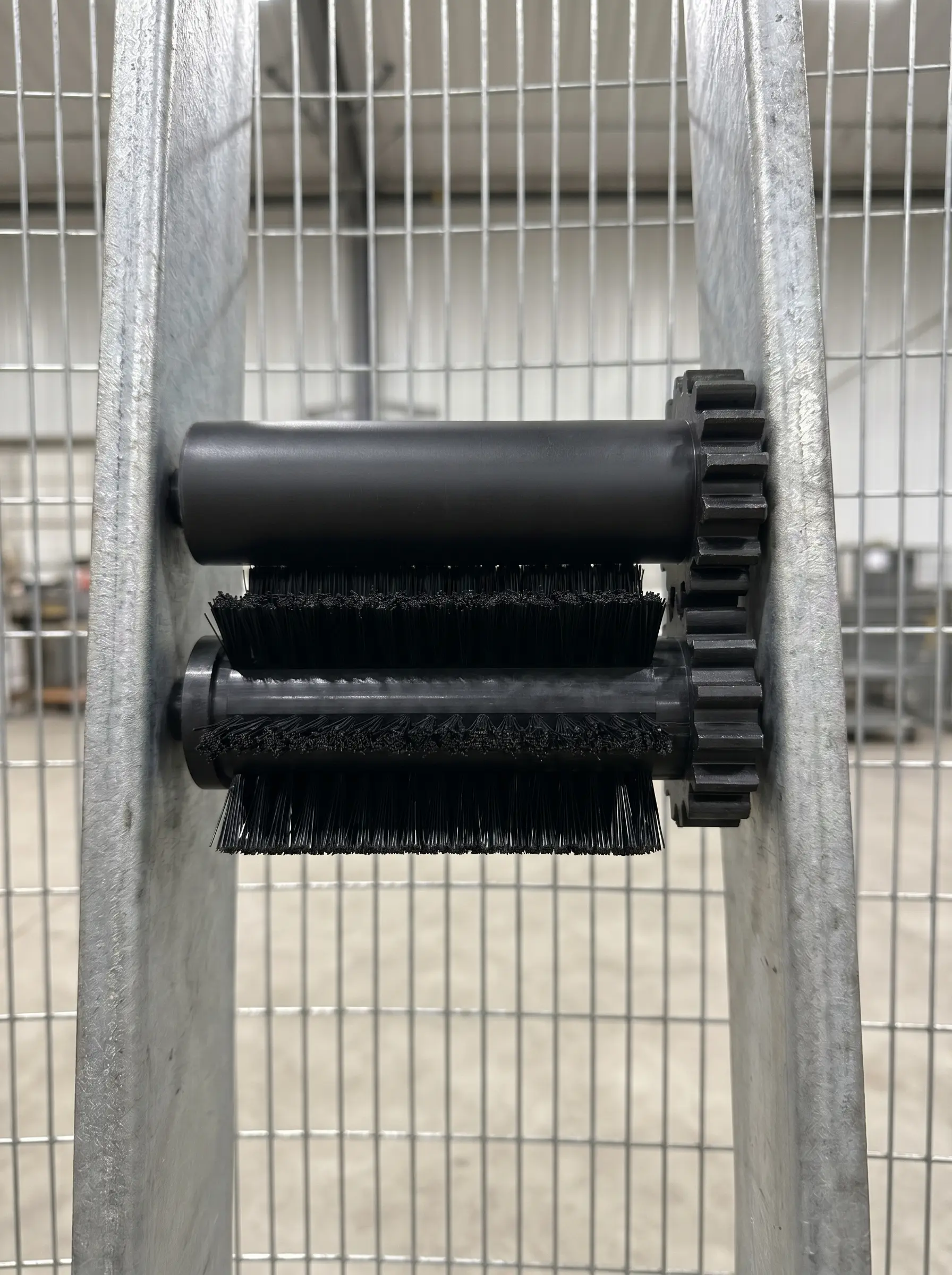 Two finished rollers mounted on the conveyor frame in service