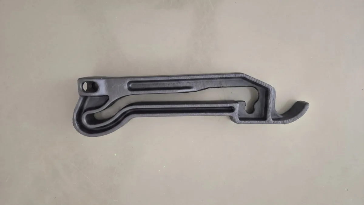 The tractor side-mirror arm remade in black ASA - a dimensionally matched drop-in replacement