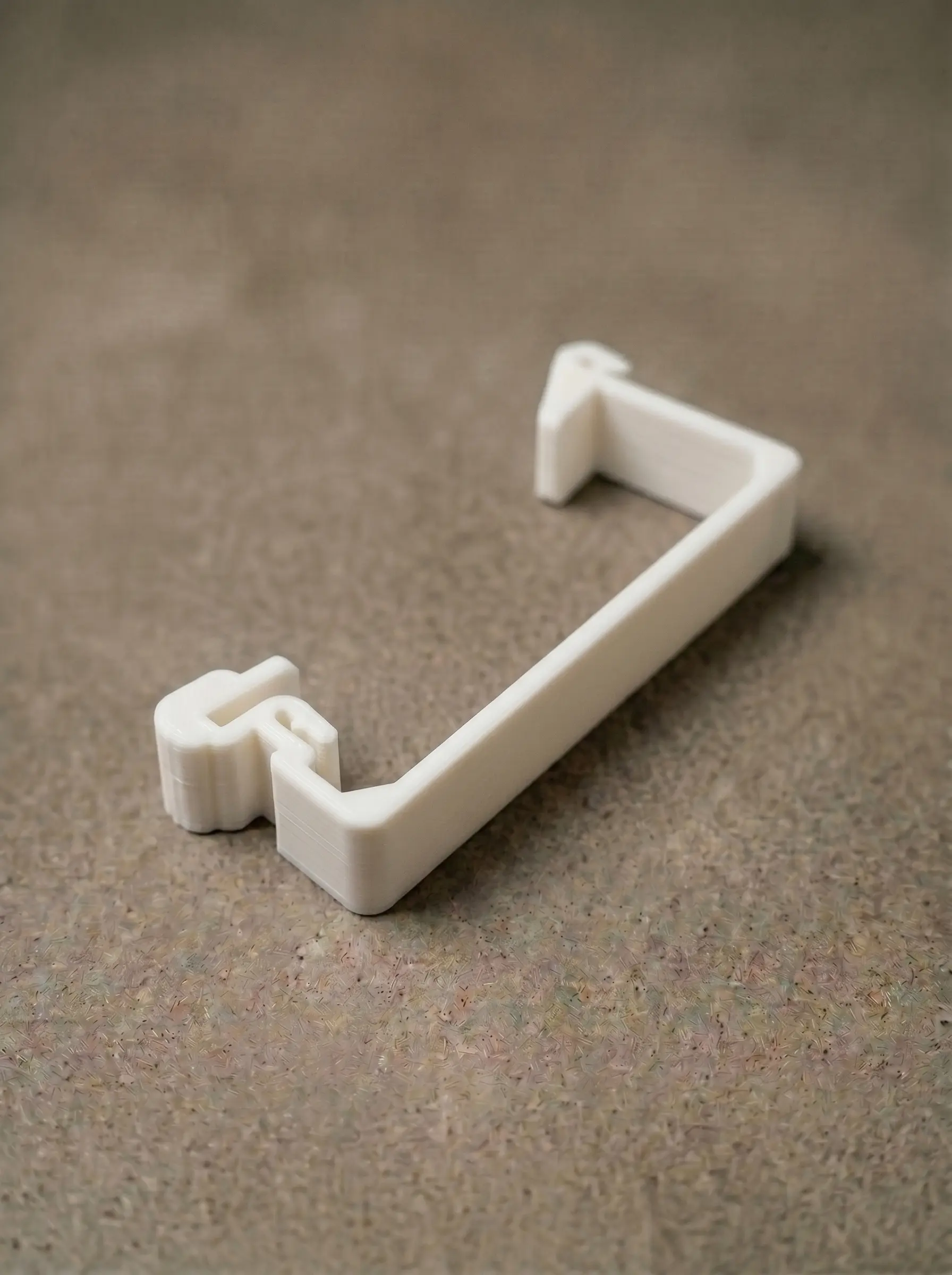 Transport-line bracket remade in PETG, replacing the broken orange original